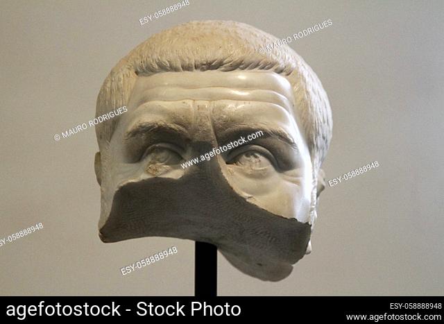 Close view of a partial broken head of an ancient roman figure