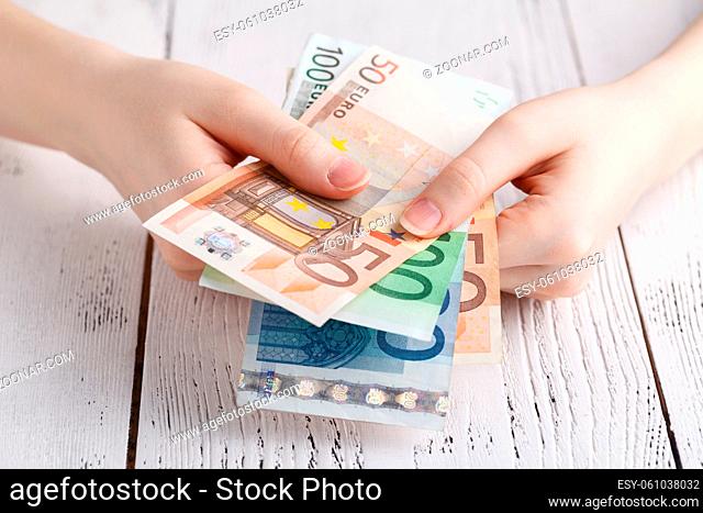 Euro banknotes money in female hands