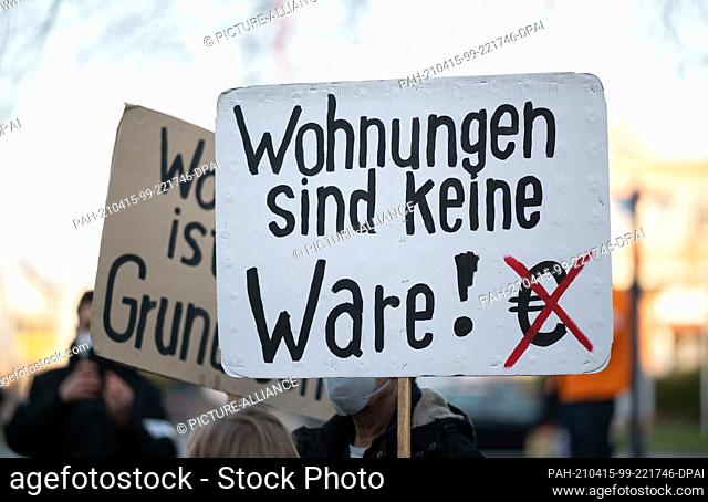 15 April 2021, Hamburg: A woman holds a sign reading ""Apartments are not a commodity!"" during a rally of the network ""Recht auf Stadt"" on the ruling of the...