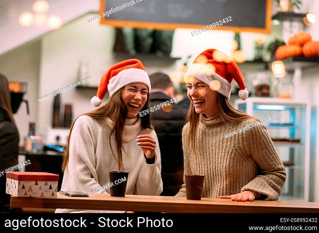 Portrait of happy cute young friends having fun in cafe. Portrait of happy cute young friends