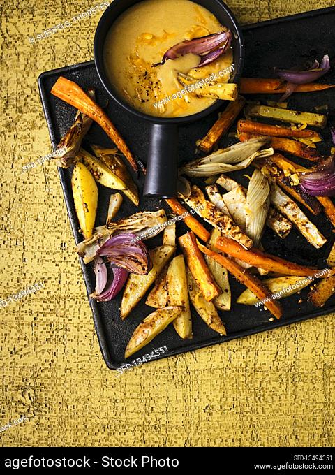 Spicy oven vegetable sticks with Altbier cheddar fondue