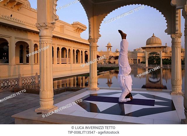 India, Udaipur, Rajastan, Uberoi Udai Vilas Hotel, man doing yoga