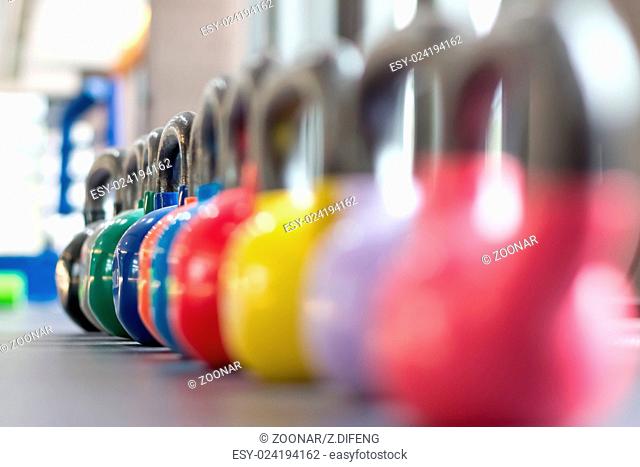 colorful kettlebells lining on table