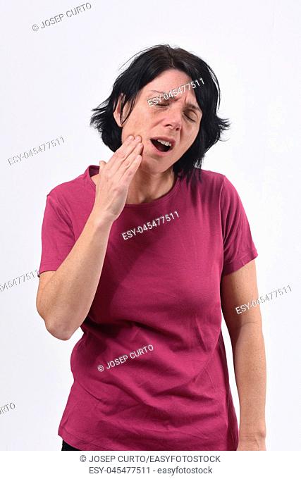 middle-aged woman with a toothache on white background