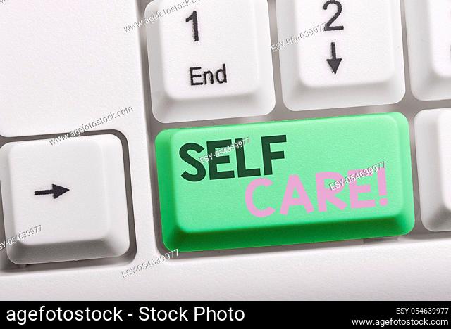 Text sign showing Self Care. Business photo showcasing practice of taking action to preserve or improve ones own health White pc keyboard with empty note paper...