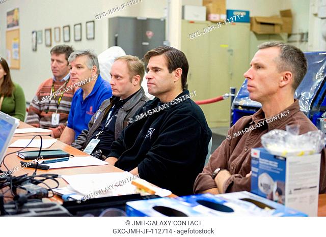 STS-134 crew members participate in an EVA Thermal Protection System (TPS) overview training session in the TPS Precision Air Bearing Facility in the Space...