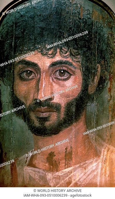 Mummy portrait from Fayum, painted portrait on wooden board attached to a mummy from the Coptic period. the Fayum mummy portraits were an innovation dating to...