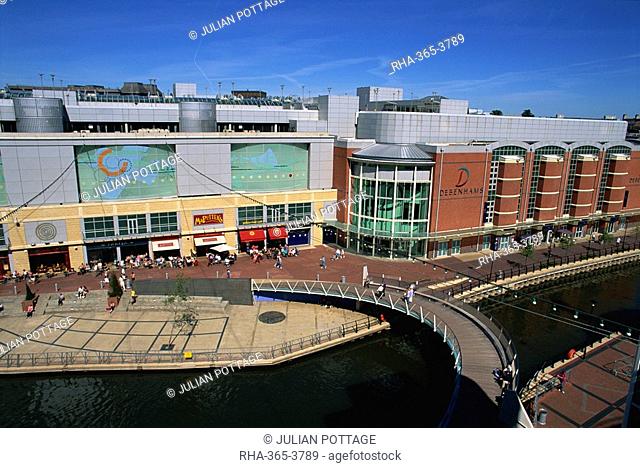 Eastern end of the Oracle shopping complex with curved footbridge over River Kennet and Debenham's store, Reading, Berkshire, England, United Kingdom, Europe