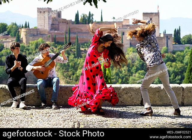 Musician and dancers performing flamenco at Alhambra, Granada, Spain