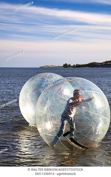 Lithuania, Western Lithuania, Curonian Spit, Nida, kids in waterball, NR