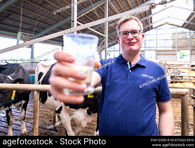 PRODUCTION - 16 August 2023, North Rhine-Westphalia, Ahaus: INI Robots in the cowshed - farmers rely on automation. The farmer Henning Lefert
