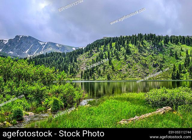 One from seven cleanest mountain Karakol lakes, located in the valley at the foot of Bagatash pass, Altai Mountains, Russia