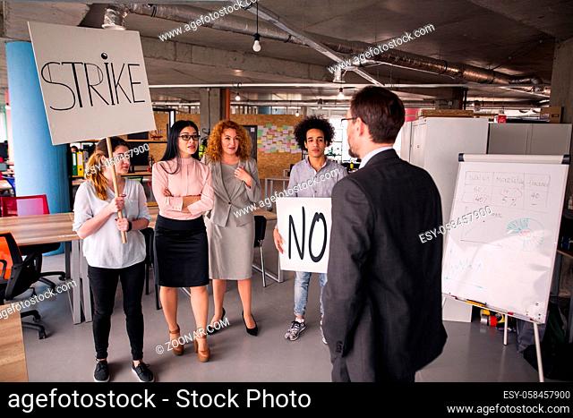 Loft style modern office, employees striking. Director negotiating with striking business team