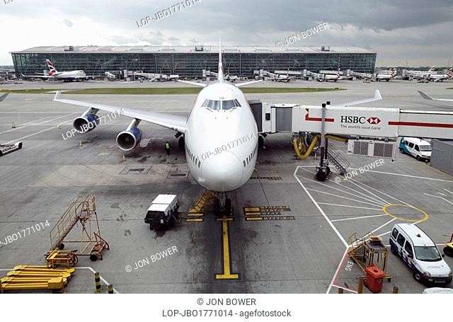 England, London, Heathrow. A jumbo jet being prepared for takeoff at Heathrow Terminal 5