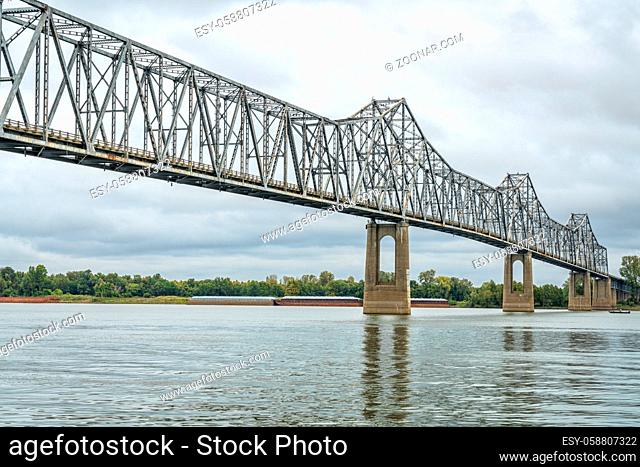 cantilever Cairo Ohio River Bridge in fall scenery with river barges in background, it provides river crossing between Wickliffe, Kentucky and Cairo, Illinois