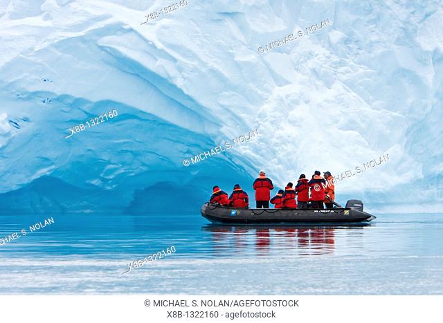 The Lindblad expedition ship National Geographic Endeavour operating fleet of Zodiacs near icebergs in and around the Antarctic peninsula, Antarctica