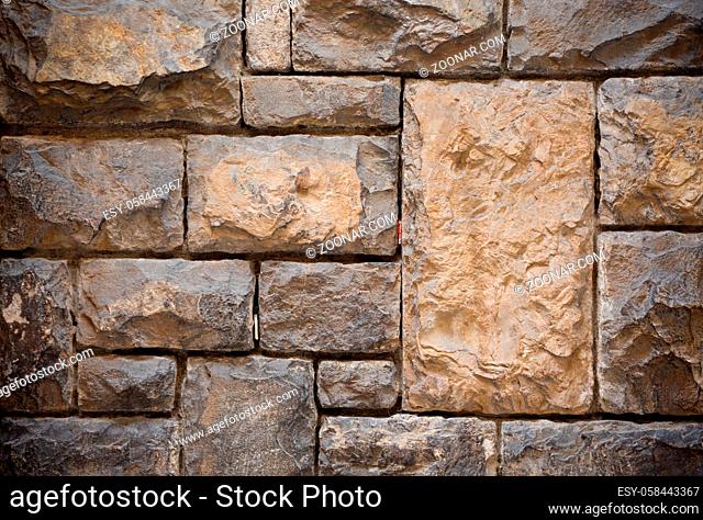 Different size brick masonry. Close up shot. Abstract texture or background