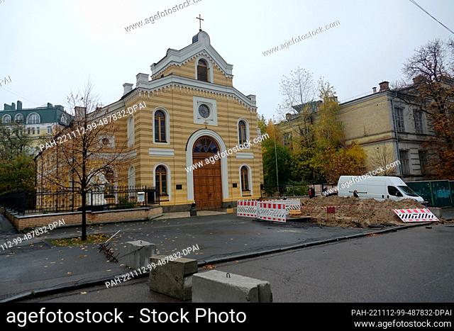PRODUCTION - 23 October 2022, Ukraine, Kiew: The German Evangelical Lutheran Church of St. Catherine in Kiev. Concrete blocks block the entrance to Ukraine's...