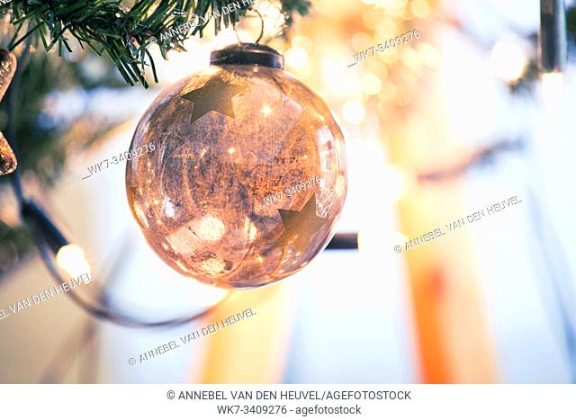Decorated Christmas tree on blurred, sparkling and fairy background, christmas balls decoration, winter holiday