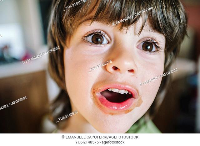 Portrait of baby with dirty mouth of chocolate
