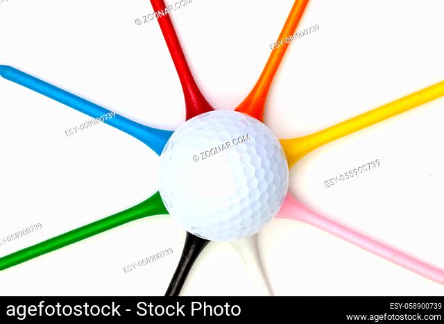 Golf set - ball with tees. Star composed of golf ball and wooden tees. Flat lay image
