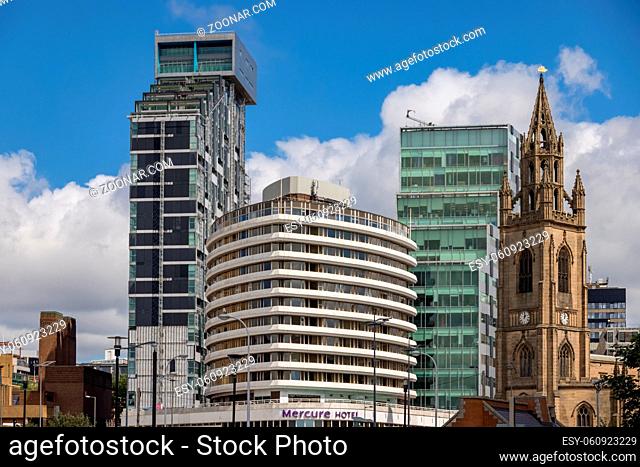 LIVERPOOL, UK - JULY 14 : Mix of old and new buildings near the waterfront in Liverpool, UK on July 14, 2021