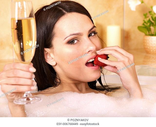 Woman swimming of bath tub