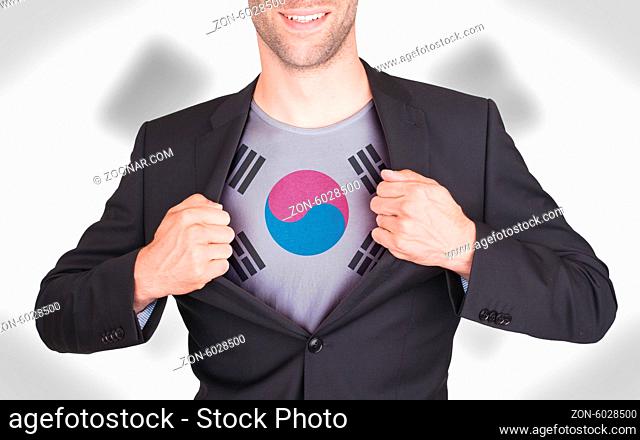 Businessman opening suit to reveal shirt with flag, South Korea