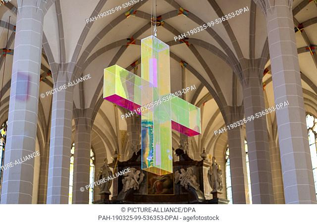 21 March 2019, Saxony, Bautzen: A ""cross of light"", created by the artist Ludger Hinse, hangs from the ceiling in St. Petri Cathedral