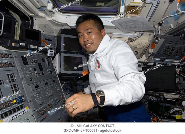 Japan Aerospace Exploration Agency (JAXA) astronaut Koichi Wakata, STS-119 mission specialist, is pictured on the aft flight deck of Space Shuttle Discovery...