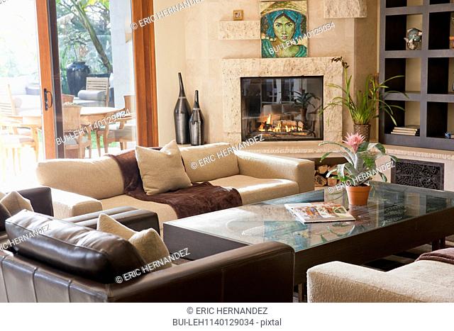 Contemporary living room with fireplace and built in shelf; Dana Point; California; USA