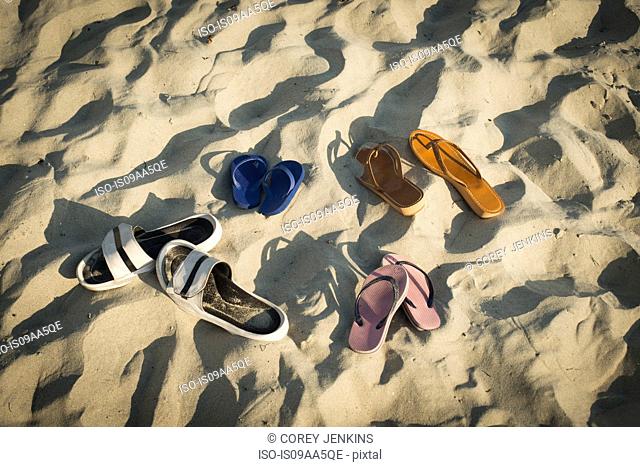 Sandals on sandy beach