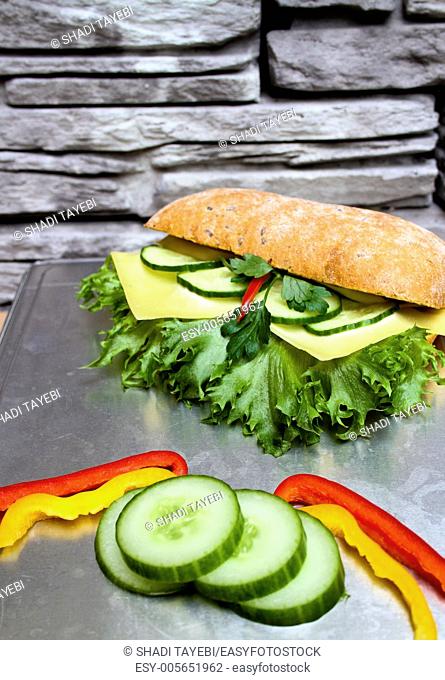 Fresh Sandwich with cucumber, cheese, pepperoni, lettuce, cheese and bread