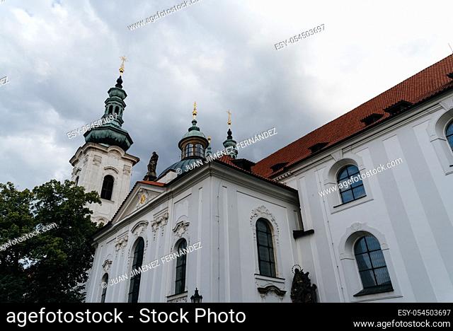 Strahov Monastery in Prague against cloudy sky. Low angle view