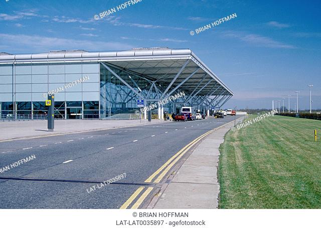 The terminal building at Stansted Airport. Cars
