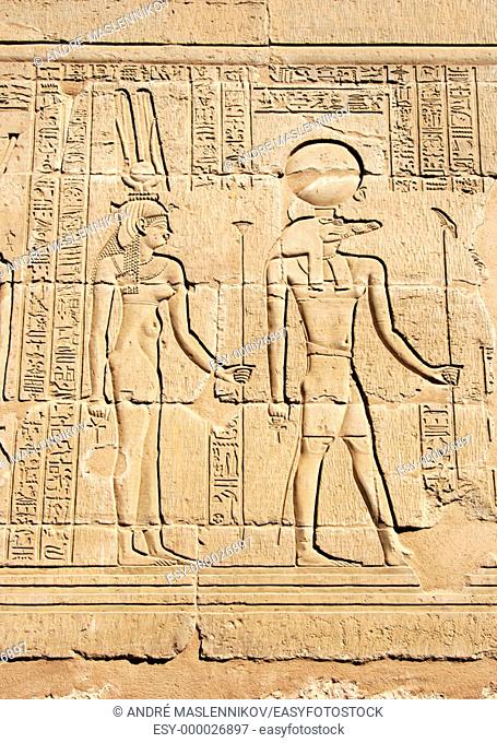 Reliefs of Sobek with crocodile head and Isis surrounded by hieroglyphs in the Crocodile temple in Kom Ombo: the temple was built in honnor of Sobek and Horus...