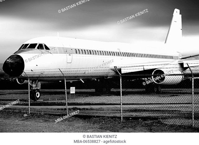 Side view of an old disused air liner on an airplane cemetery