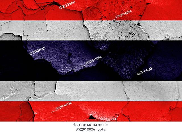 flag of Thailand painted on cracked wall