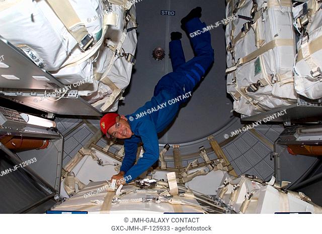 NASA astronaut Rick Sturckow, STS-128 commander, works in the Leonardo Multi-Purpose Logistics Module (MPLM), temporarily attached to the International Space...