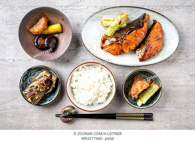 Traditional Japanese dish with Fish Teriyaki and Rice as close-up in bowls