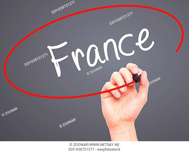 Man Hand writing France with black marker on visual screen