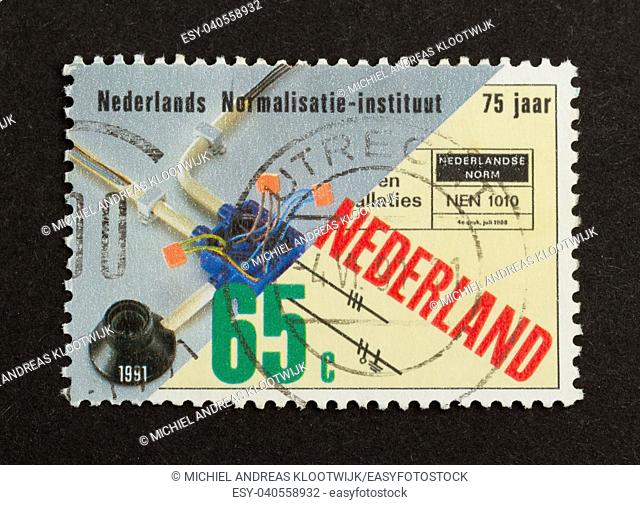 HOLLAND - CIRCA 1990: Stamp printed in the Netherlands shows an electrical cirquit, circa 1990