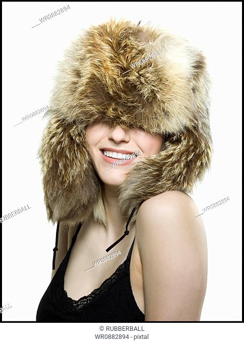 Close-up of a young woman wearing a fur hat