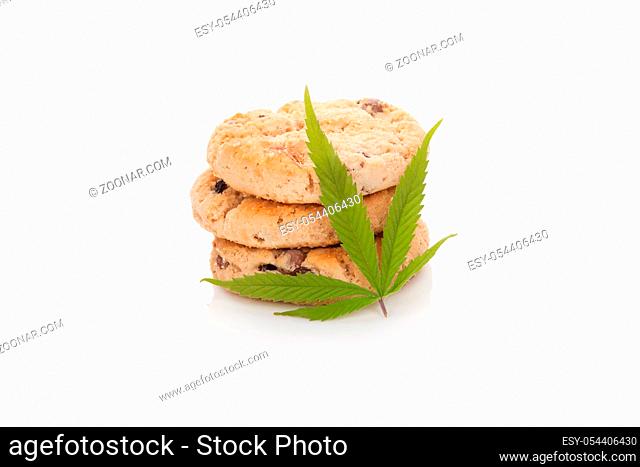 Chocolate cookies with marijuana leaf isolated on white background. Space cookies