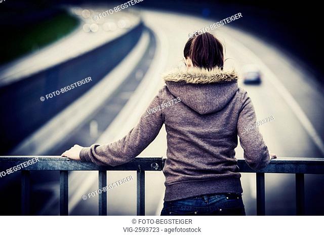 woman on a highway bridge railing - 18/04/2011