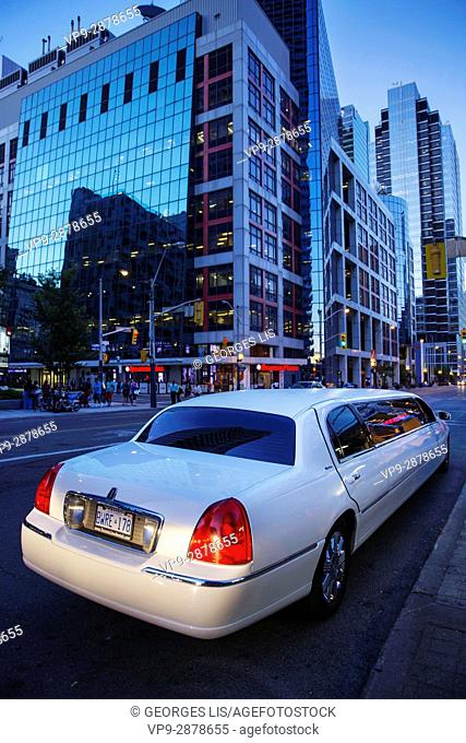 limousine car avenue glass buildings night downtown Toronto Ontario