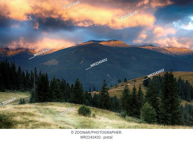 Carpathian mountain hills at cloudy sunrise