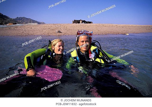 Egypt, Sinai desert, women diving in the Gulf of Acaba