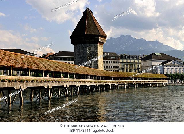 Chapel Bridge over Reuss River in Lucerne, Pilatus Mountain looming above the city at back, Canton of Lucerne, Switzerland, Europe