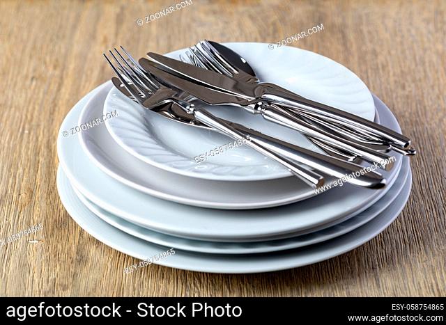 plate and cutlery on a wooden background